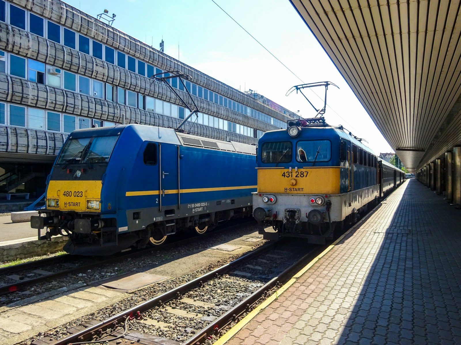 Two trains at a station platform